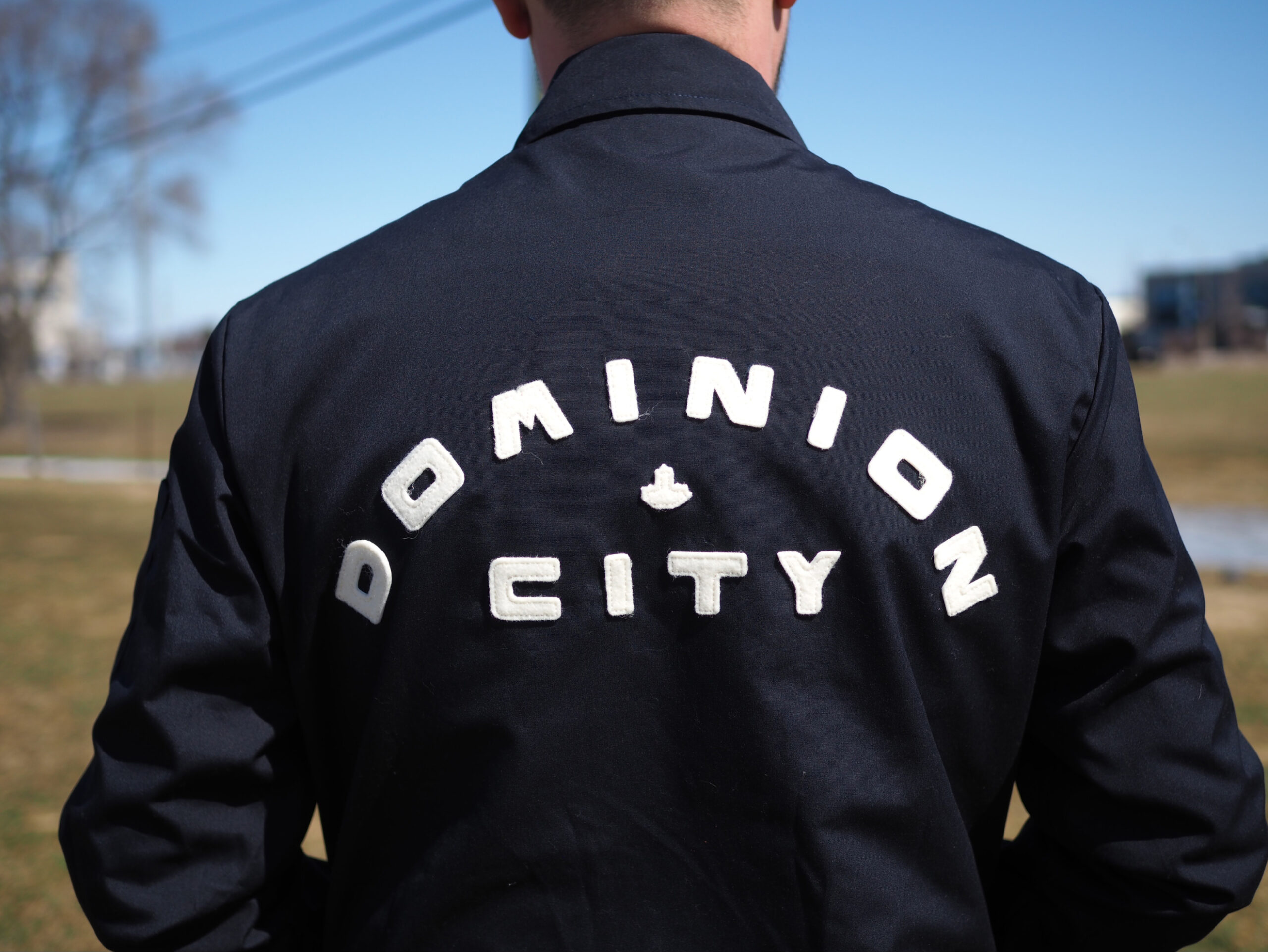 Jacket with Dominion City Branding on the back.