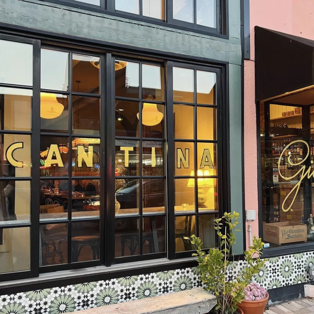 Gold lettering outside Cantina Gia's windows.